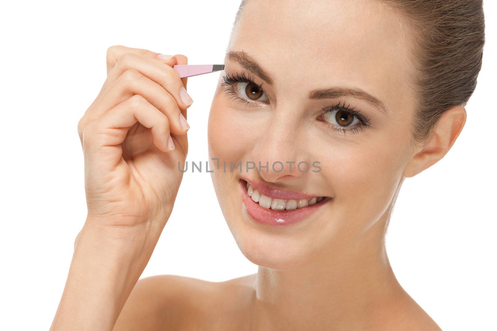 beautiful young woman and eyebrow tweezers isolated on white
