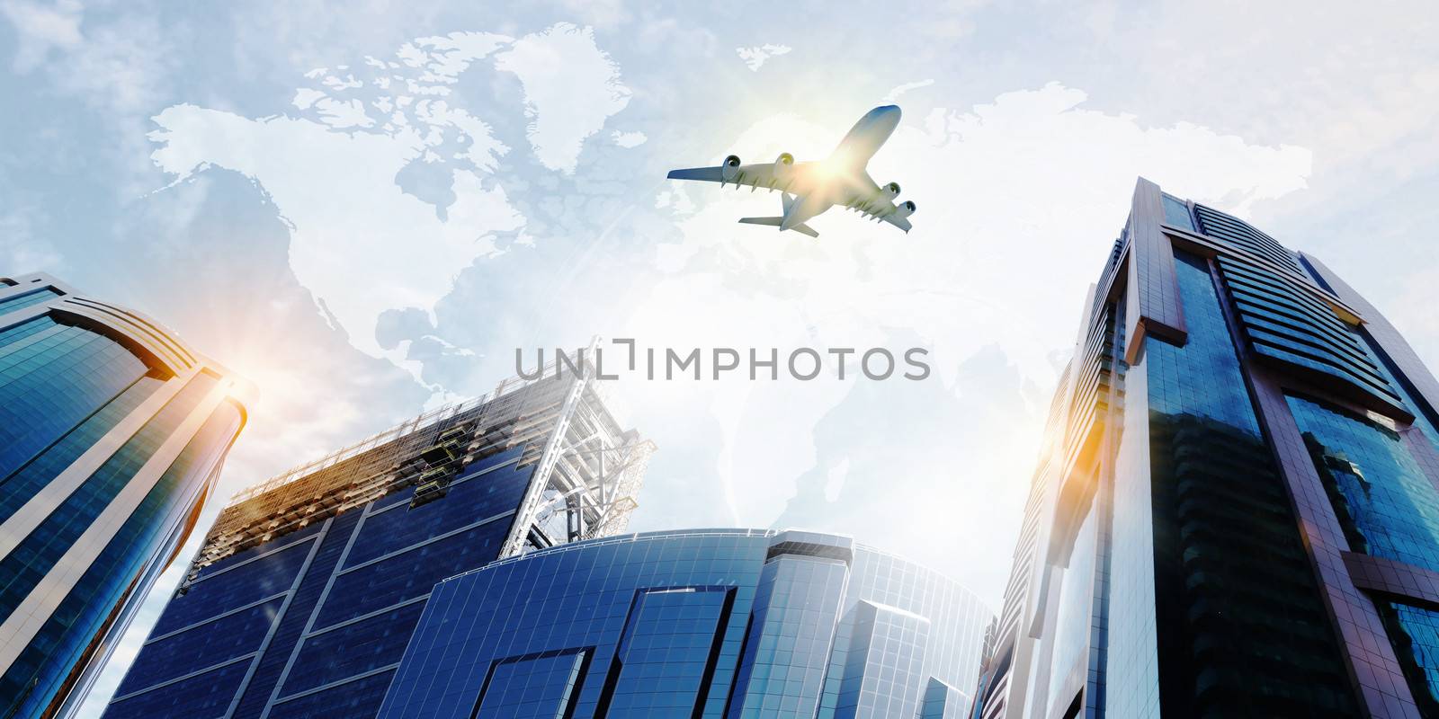 Plane flying above skyscrapers. Business travel concept