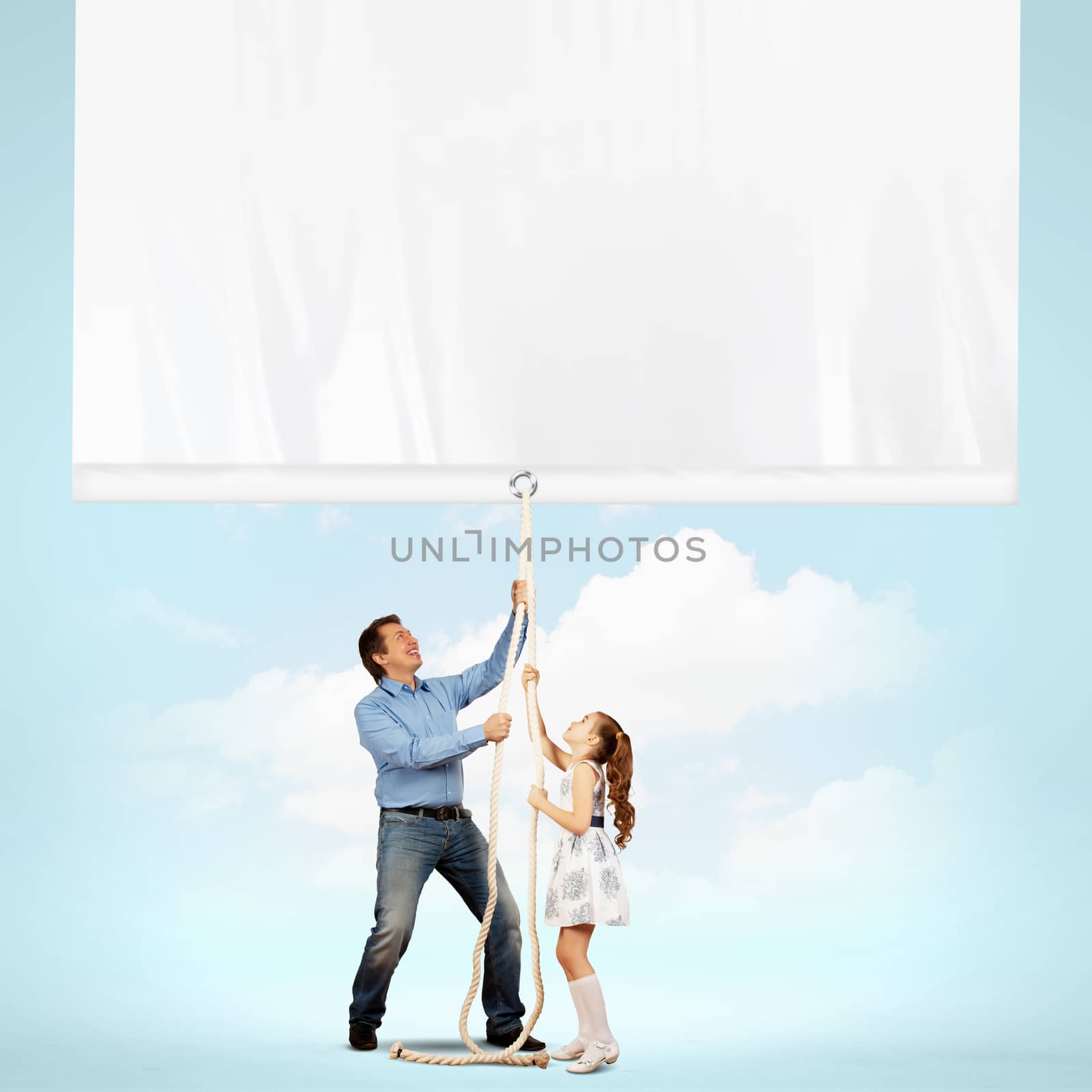 Man and little girl pulling banner. Place for text