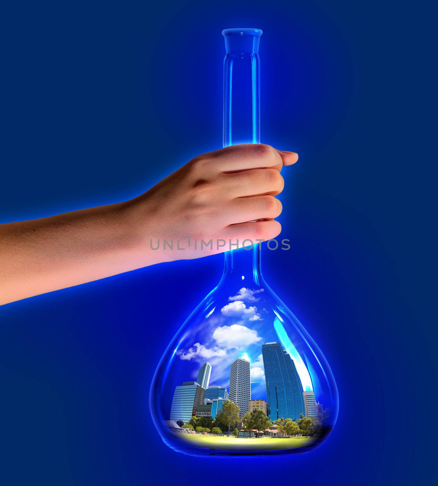 Close up of human hand holding test tube. Ecology concept