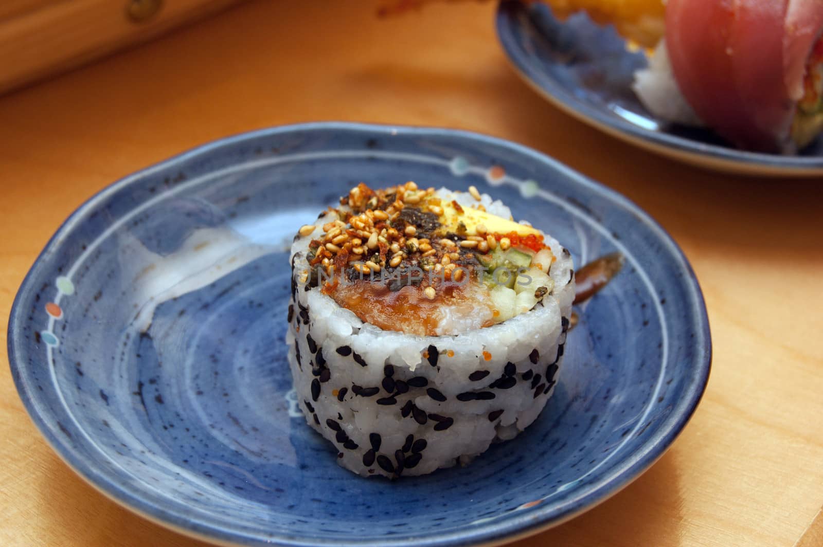 Seafood roll on blue plate