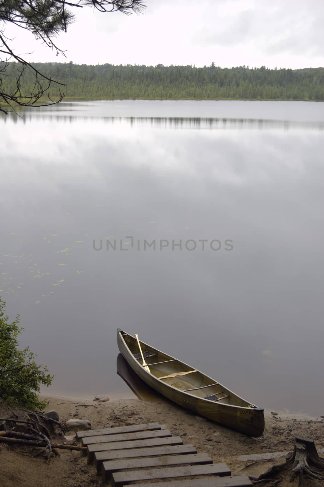 Lake and canoe by PavelS