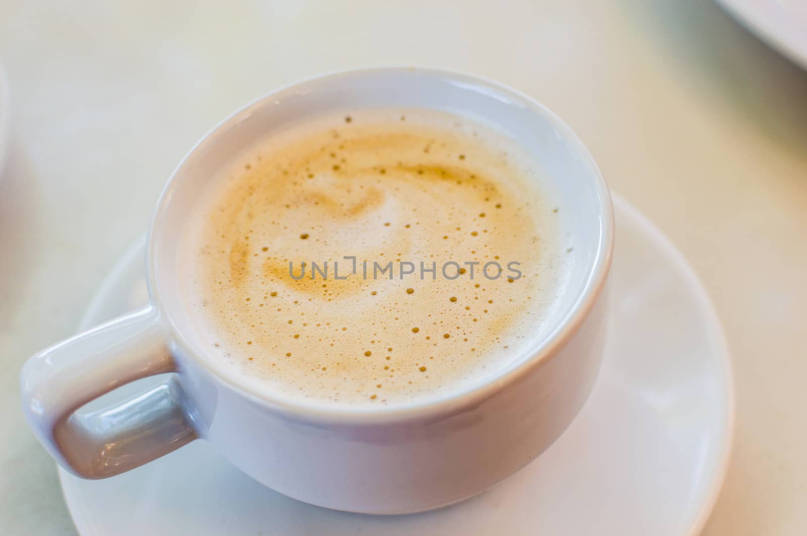 Hot Coffee in white cup and drink it in the morning with breakfast.