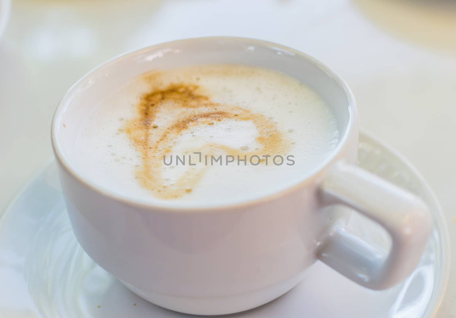 Hot Coffee in white cup and drink it in the morning with breakfast.