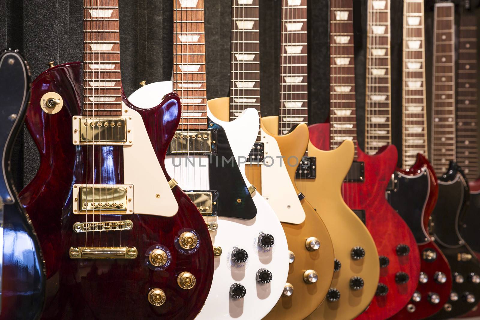 A row of electric Guitar on display