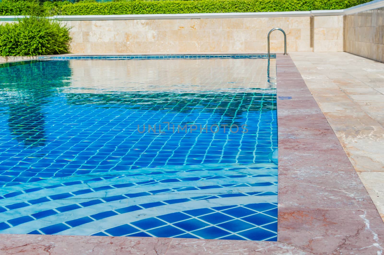 Pool blue color amid natural forest in Thailand.