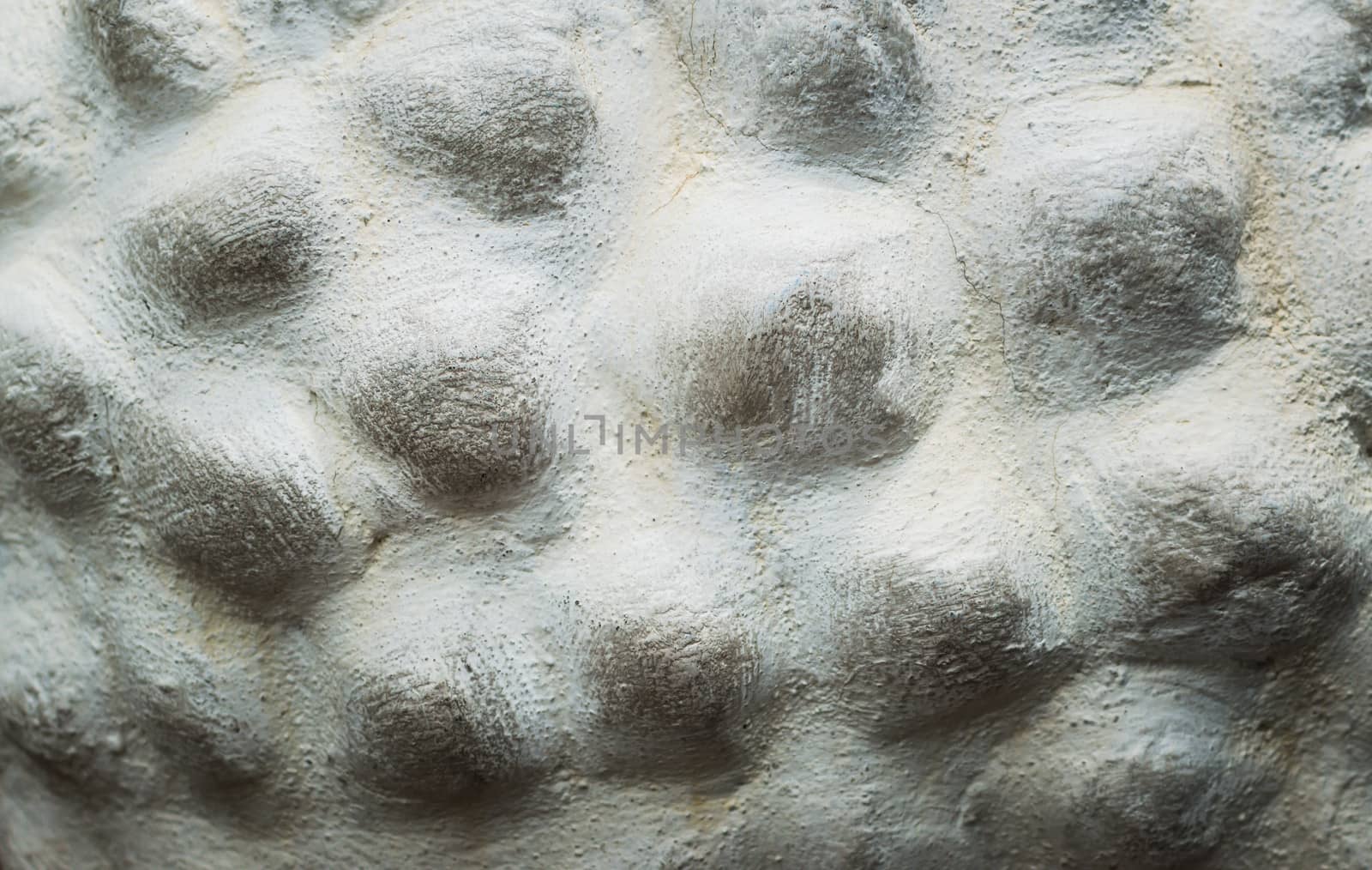 Embossed stone seamless background.