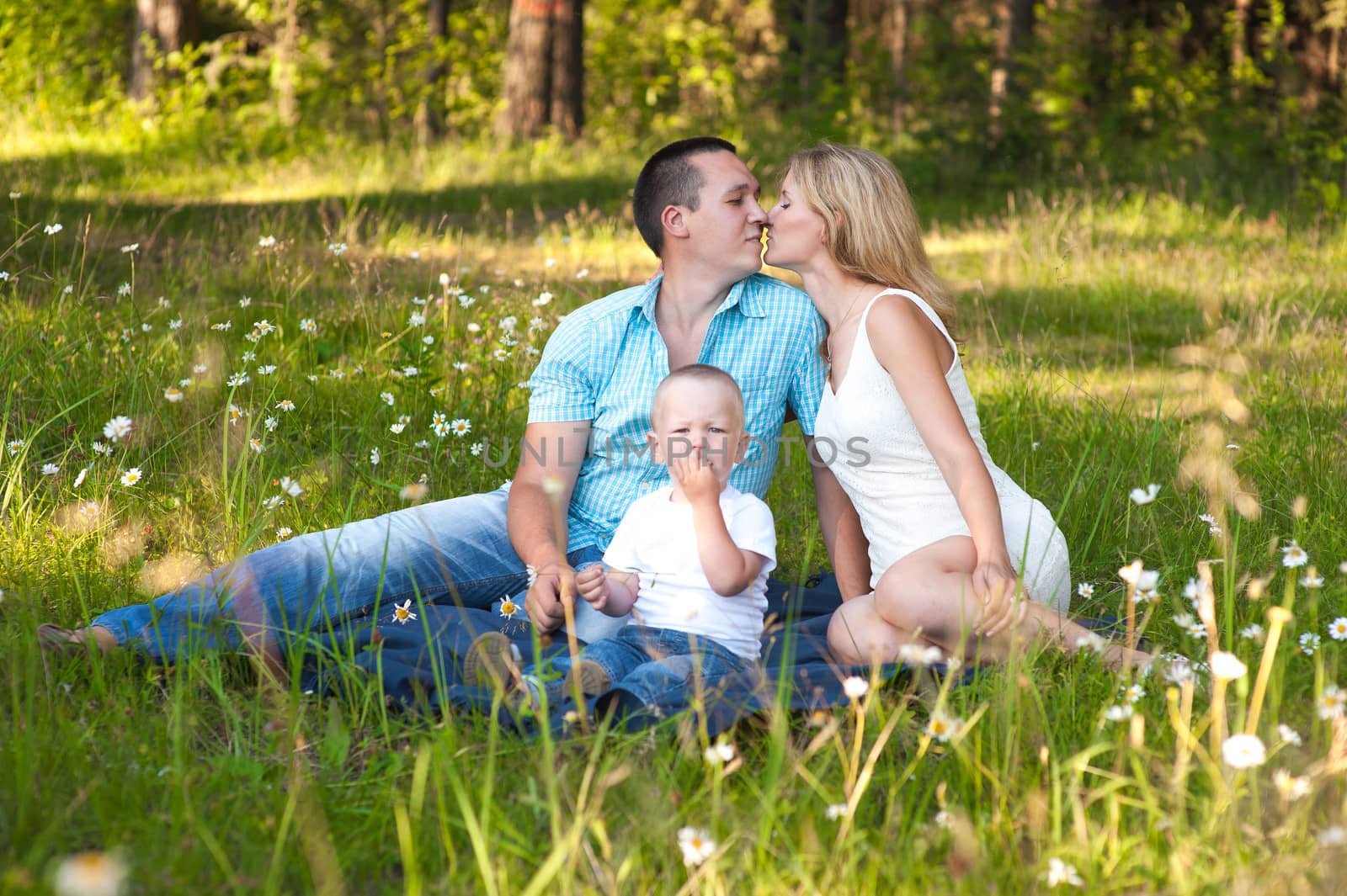 Young family recreate in park.