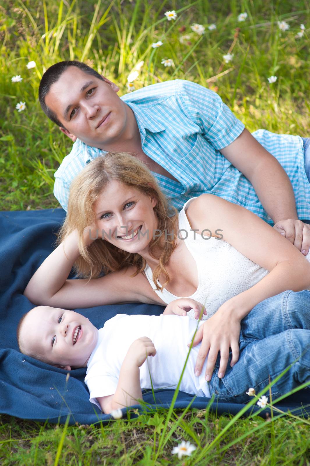 Young family recreate in park.