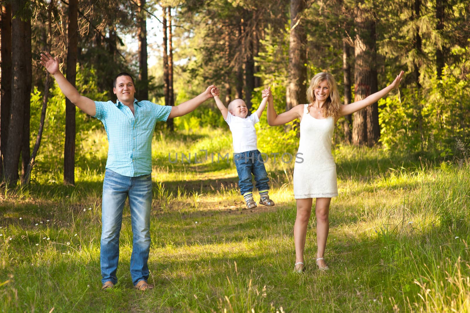 Young family recreate in park.