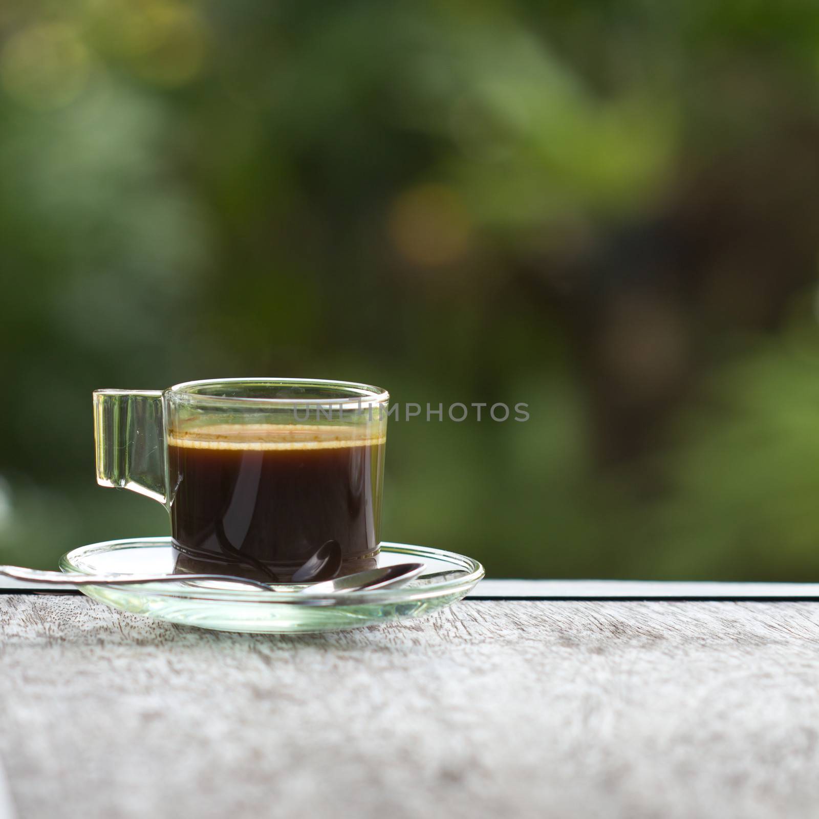 Black coffee in a glass on the table