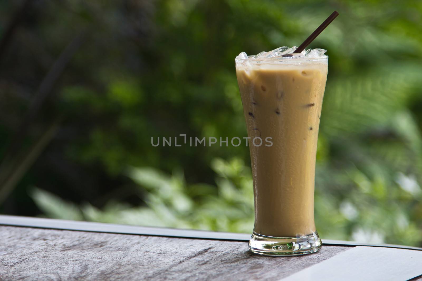 Ice coffee on a wooden table