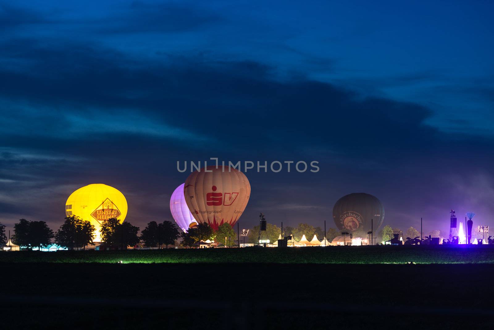 OSTFILDERN, GERMANY - AUGUST 17,2013: Flammende Sterne (flaming stars), the world fireworks championship is happening as a large festival accompanied by hot air balloons and tents on August 17, 2013 in Ostfildern near Stuttgart, Germany.