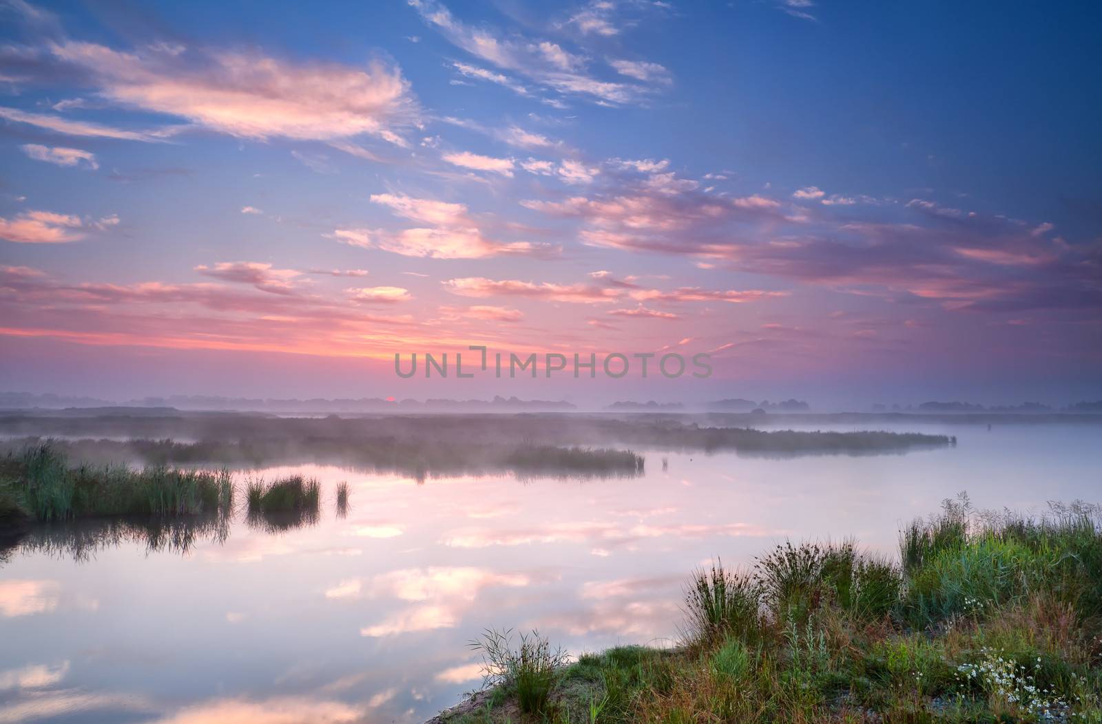 warm summer sunrise over river, Groningen, Netherlands
