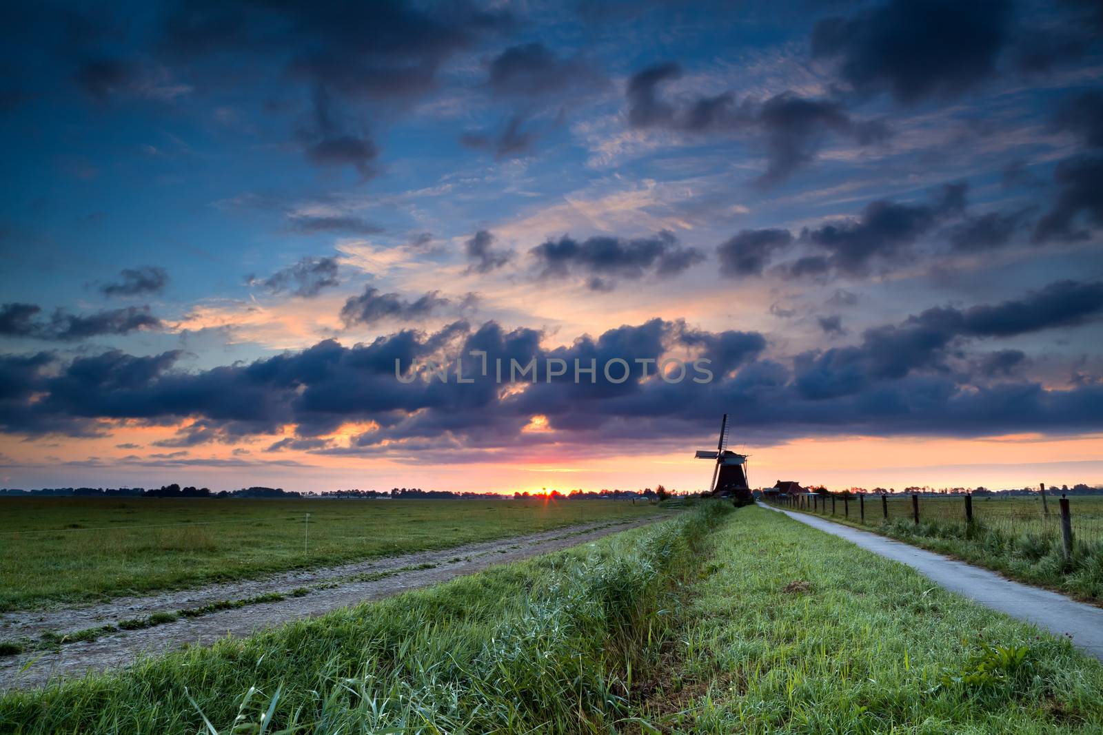 summer sunrise and Dutch windmill, Groningen, Netherlands