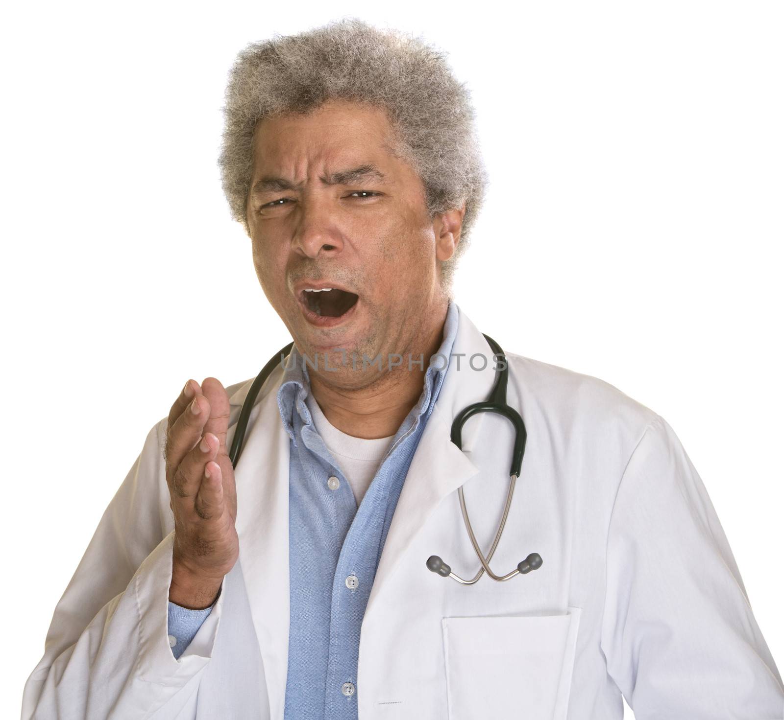Sleepy medical doctor yawning over white background