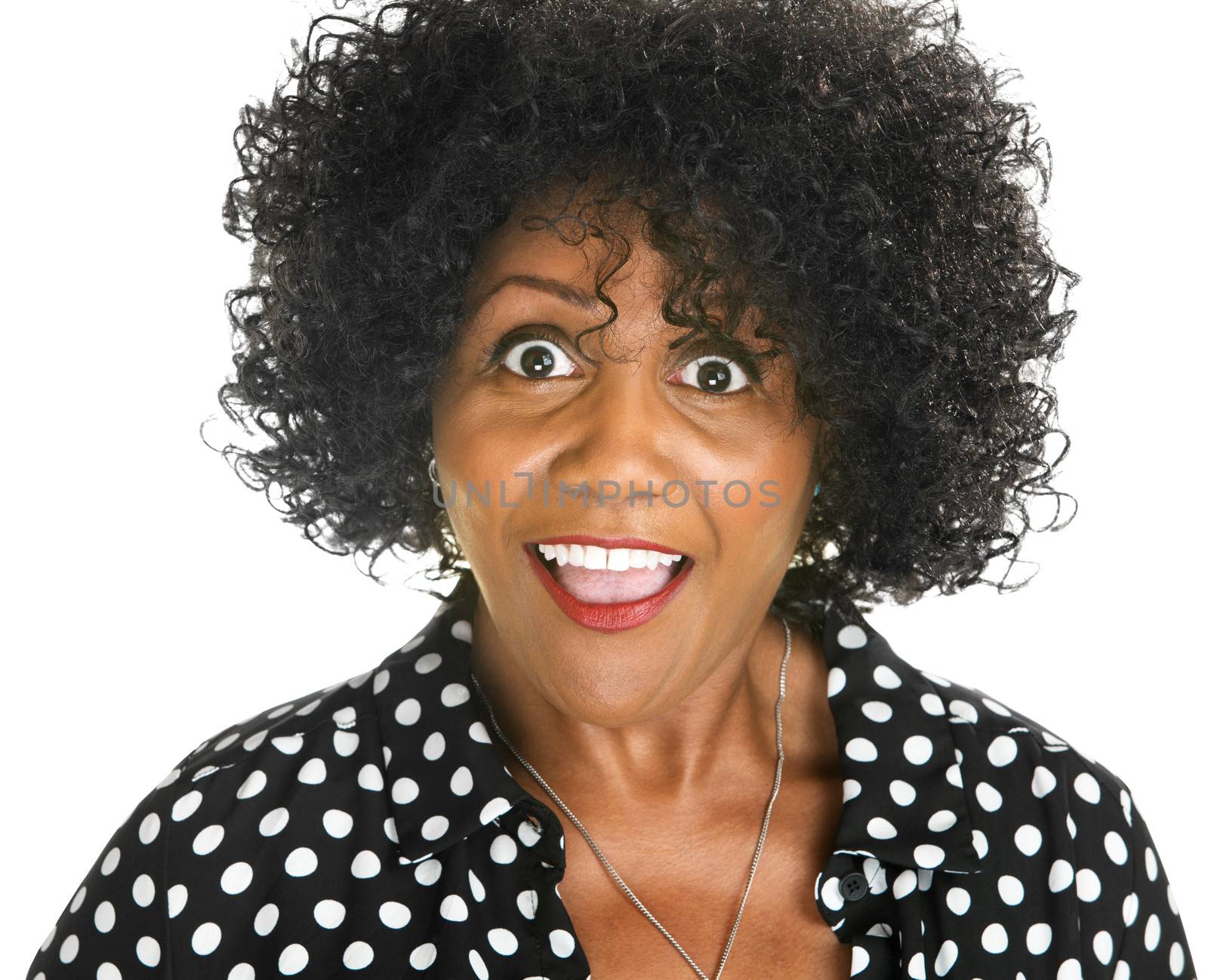 Amazed middle aged African woman on isolated background