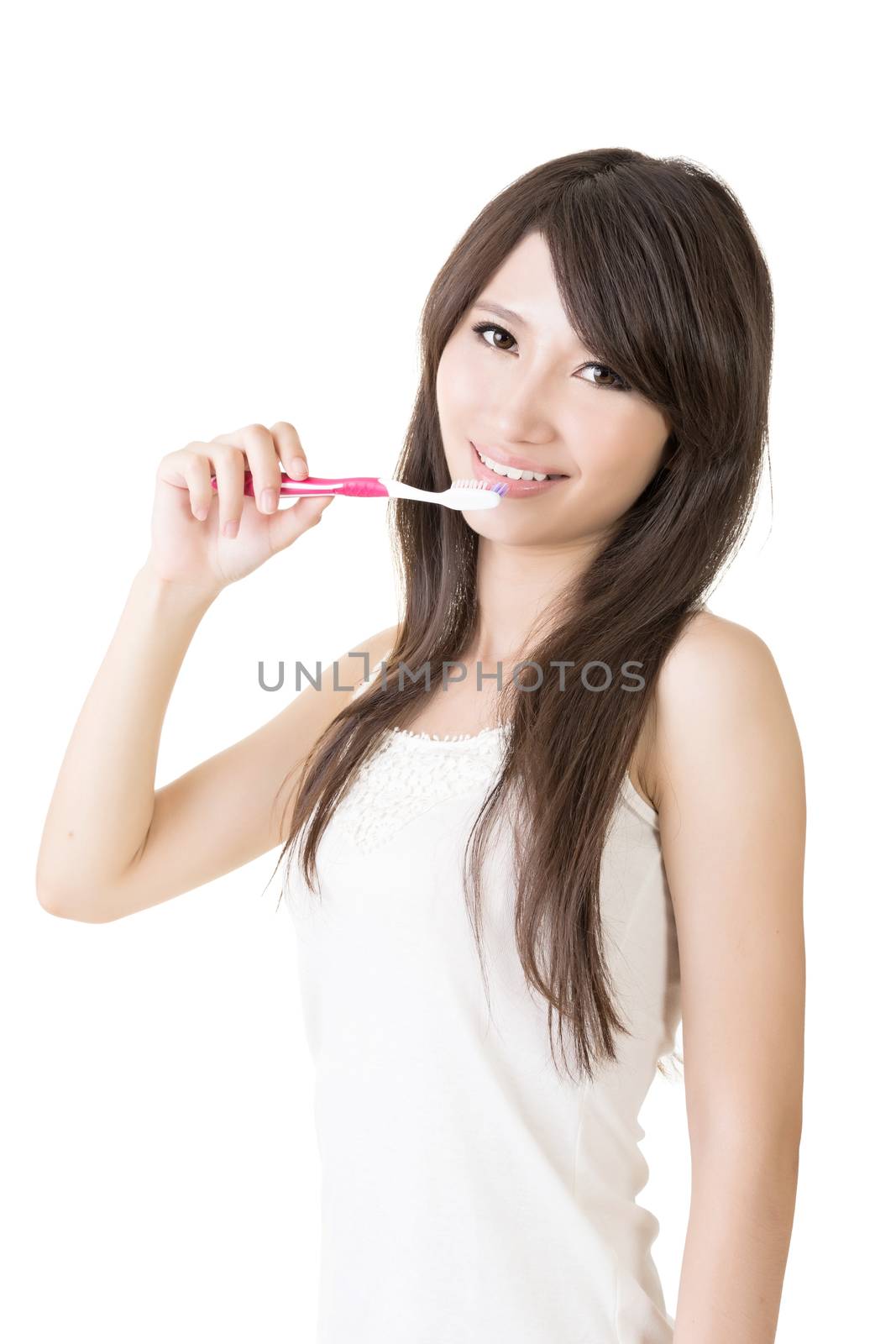 Attractive asian woman brushing teeth by elwynn