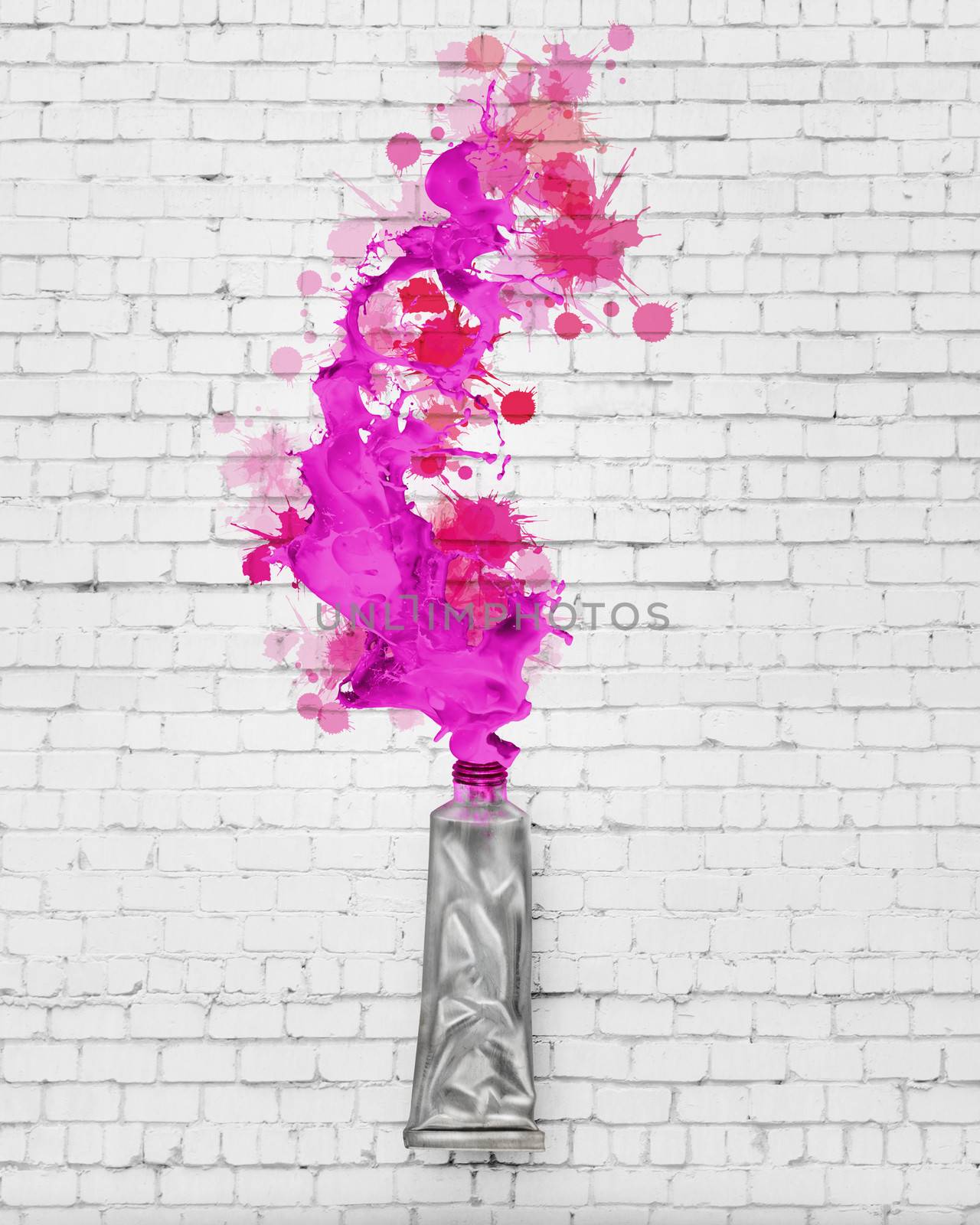 Image of paint tube with color splashes