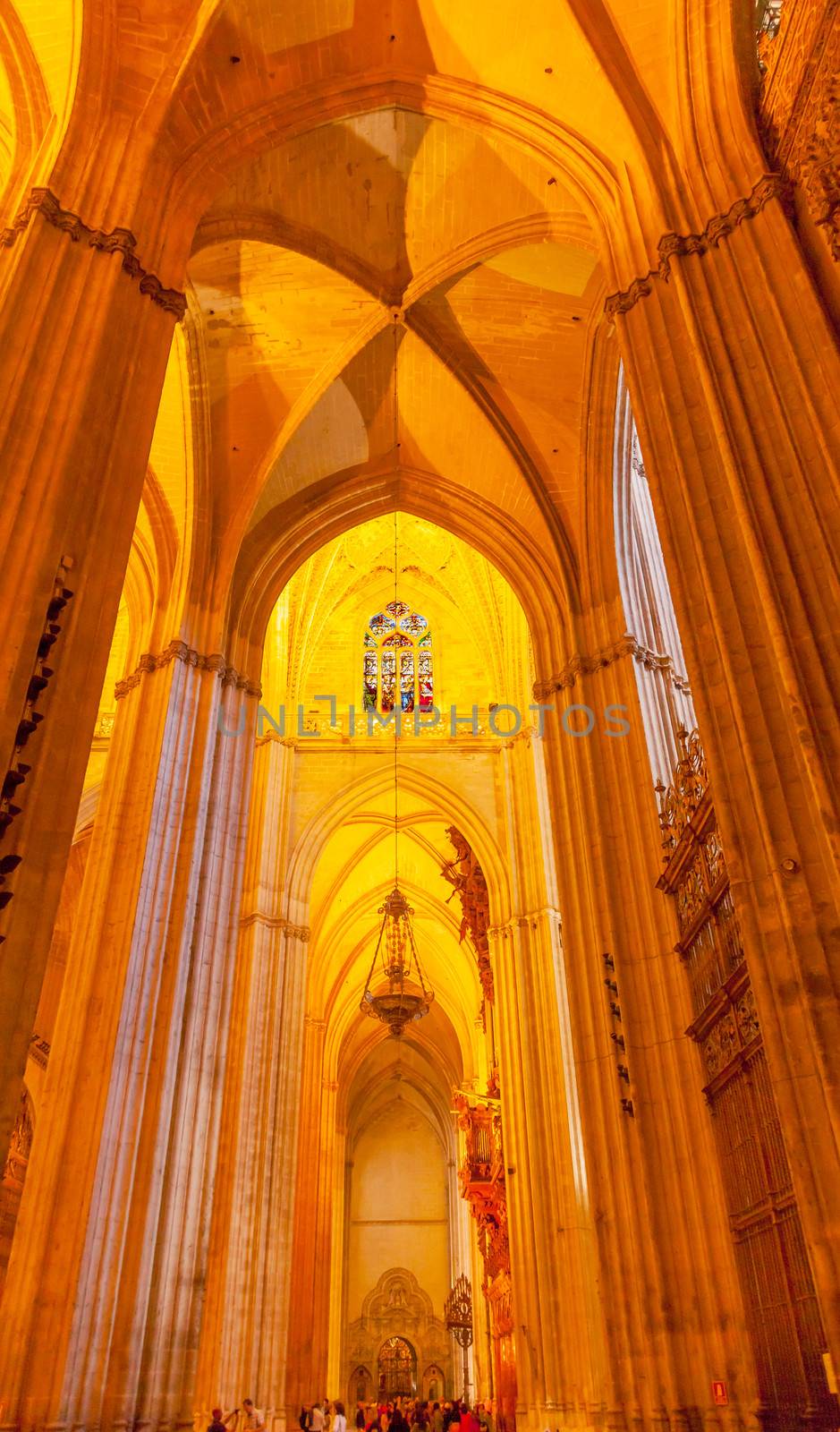 Arch Stained Glass Parisioners Seville Cathedral, Cathedral of Saint Mary of the See, Seville, Andalusia Spain.  Built in the 1500s.  Largest Gothic Cathedral in the World and Third Largest Church in the World.  Burial Place of Christopher Columbus.