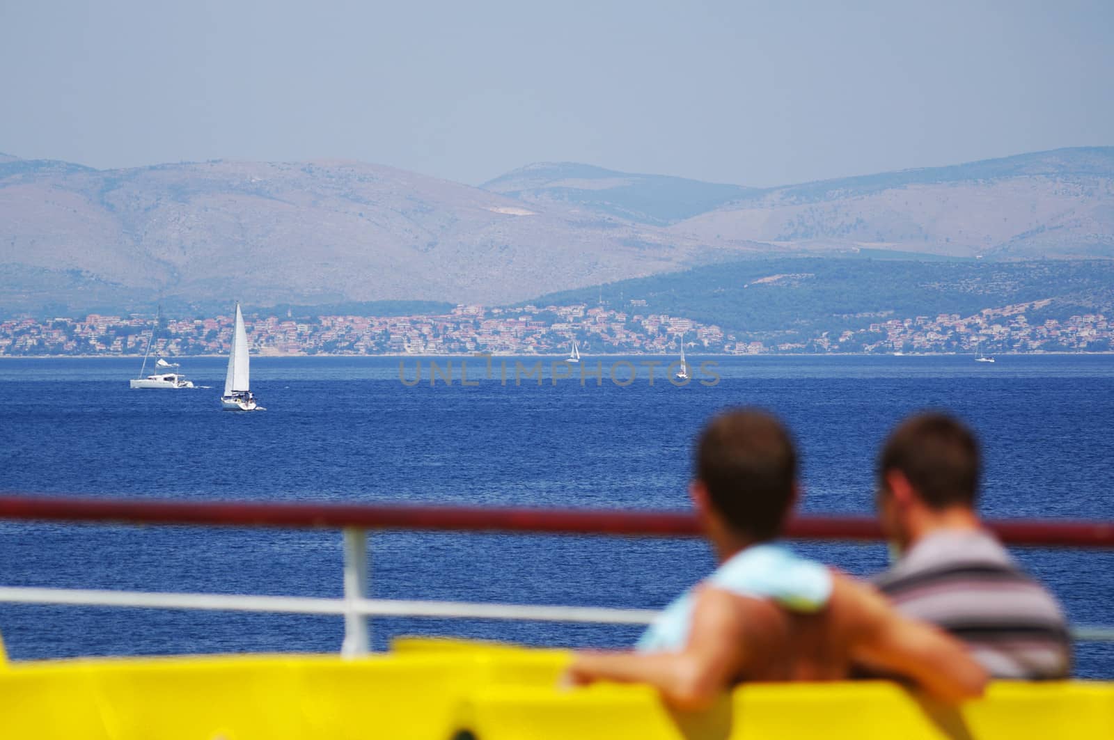 Blured people on boat sun deck, with nice background