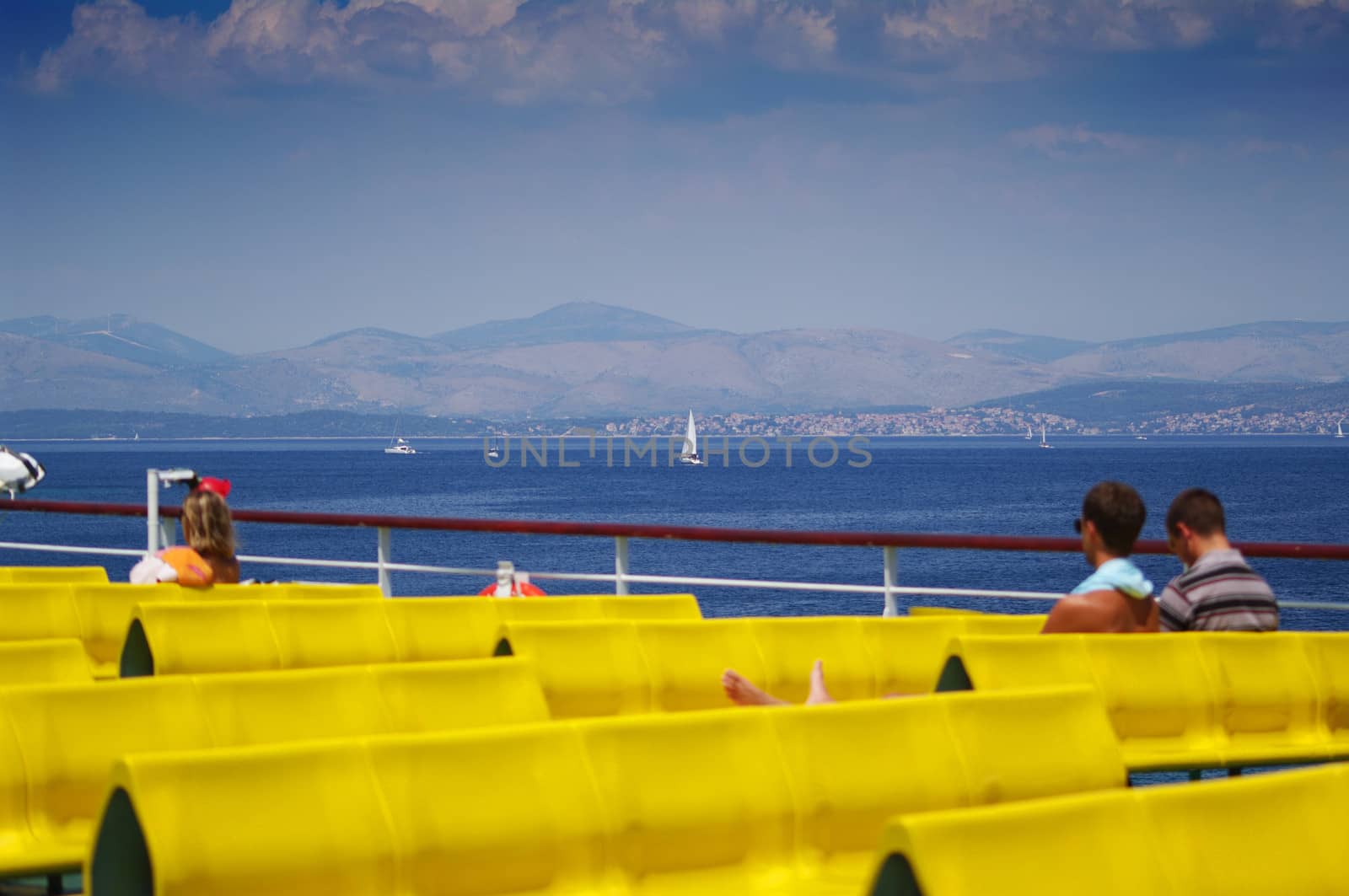 Blured people on boat sun deck, with nice background