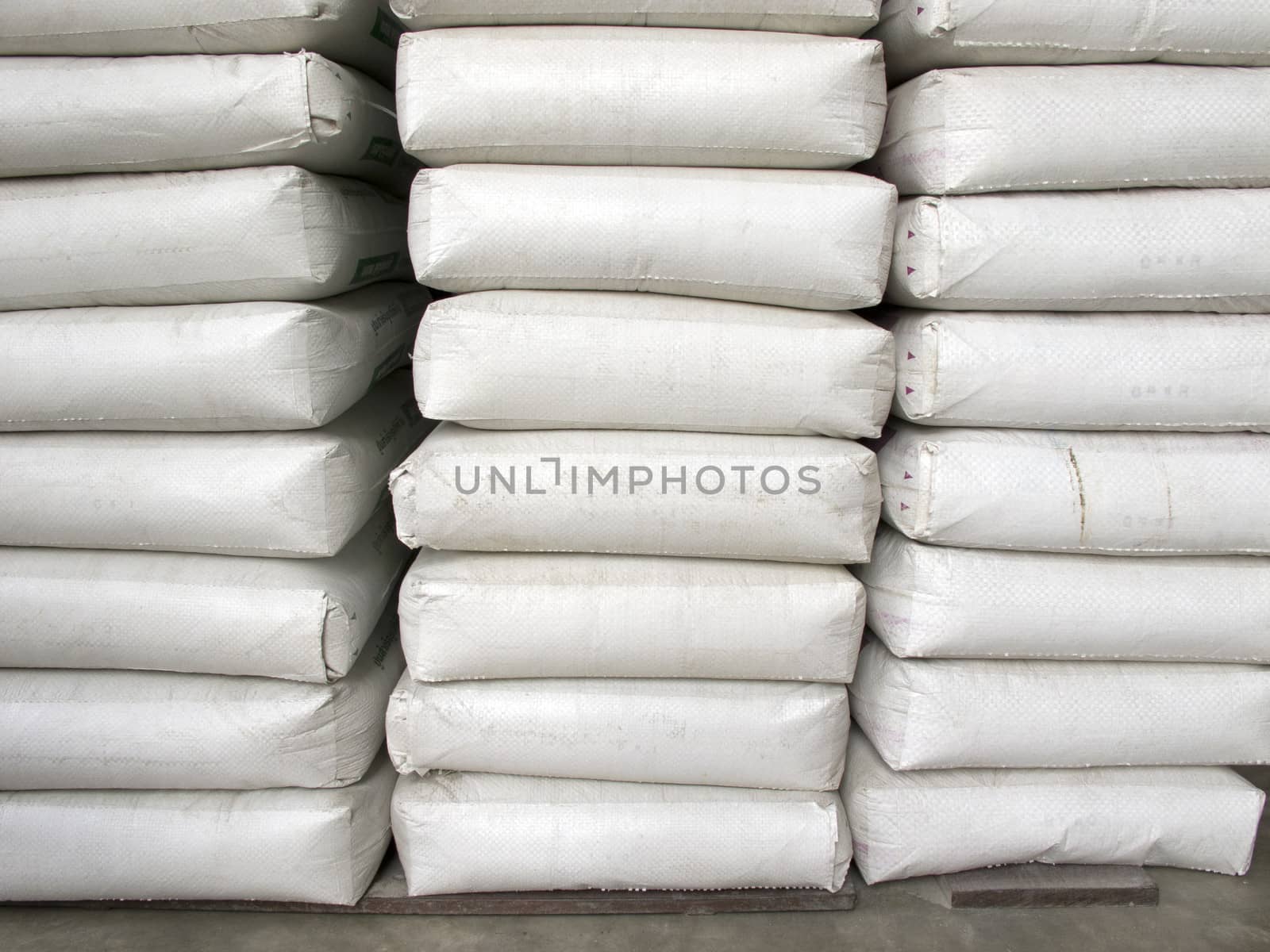 Pile of white plastic sacks in warehouse