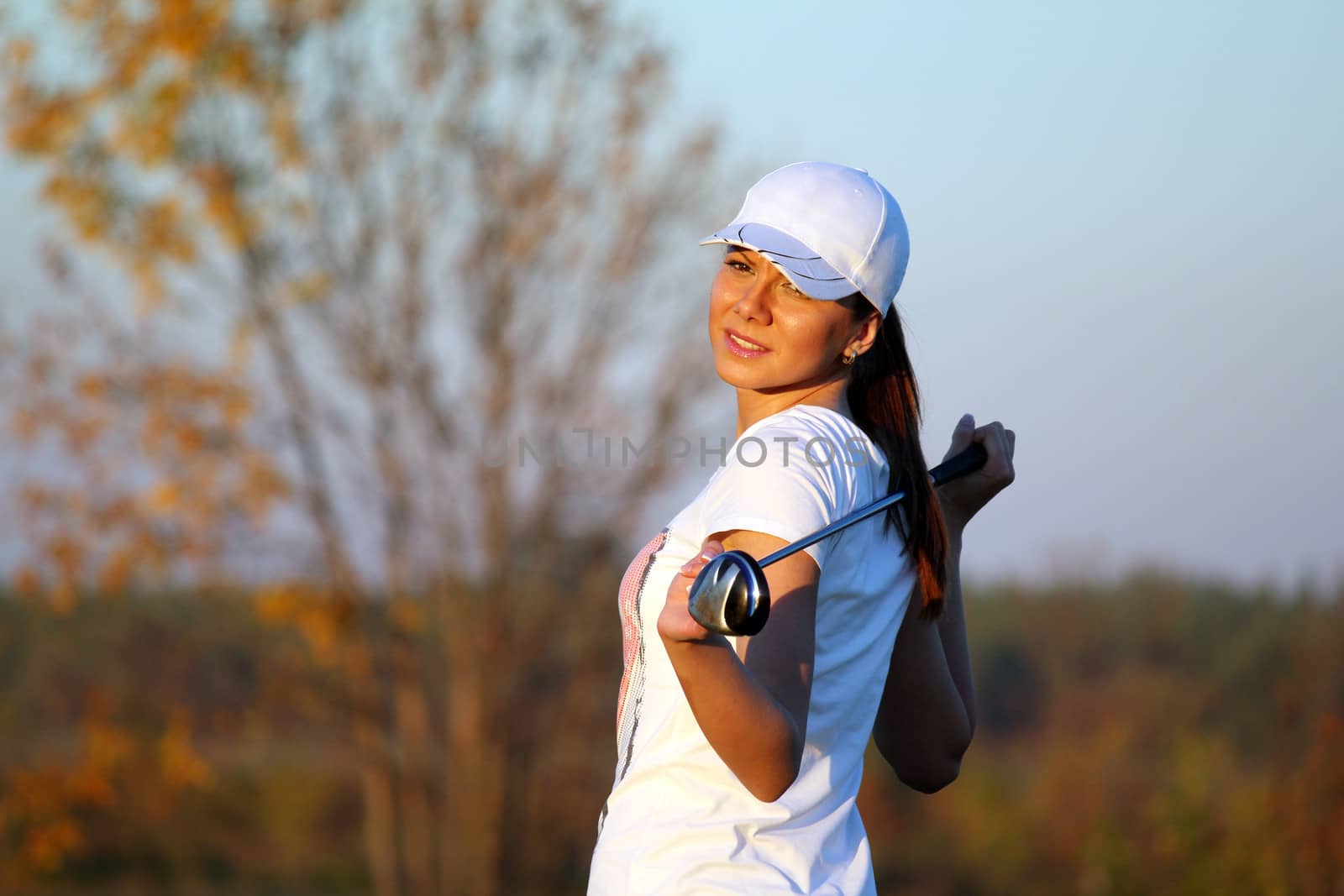 girl golf player outdoor portrait by goce