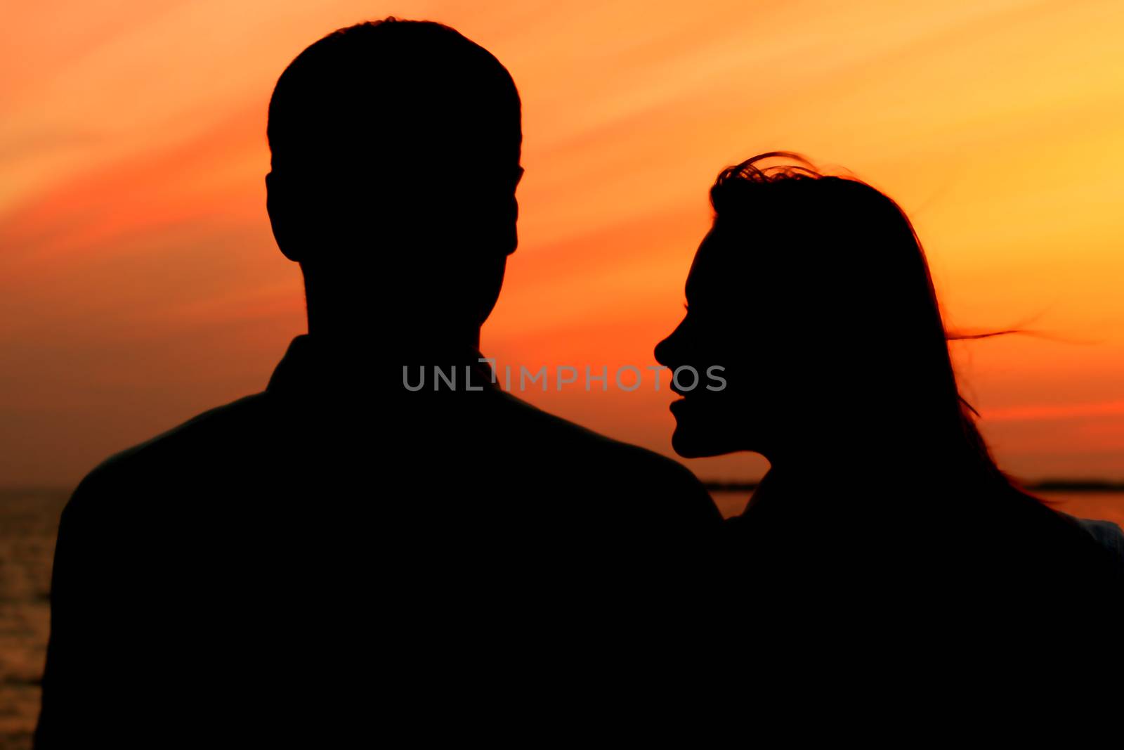 relax on gold sunset  romance flirt of two person on vacation