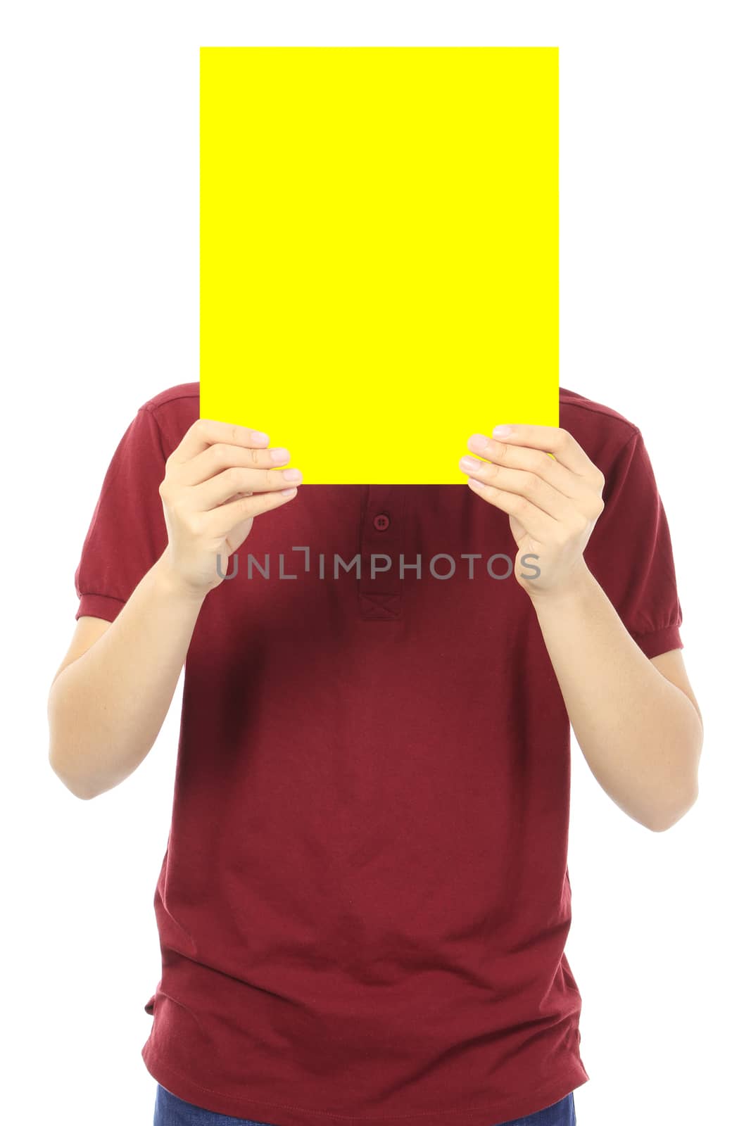 A young man holding a blank yellow signboard