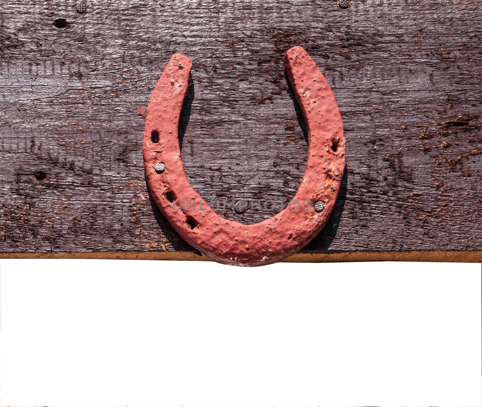 The old horseshoe hanging on wooden wall by Zhukow