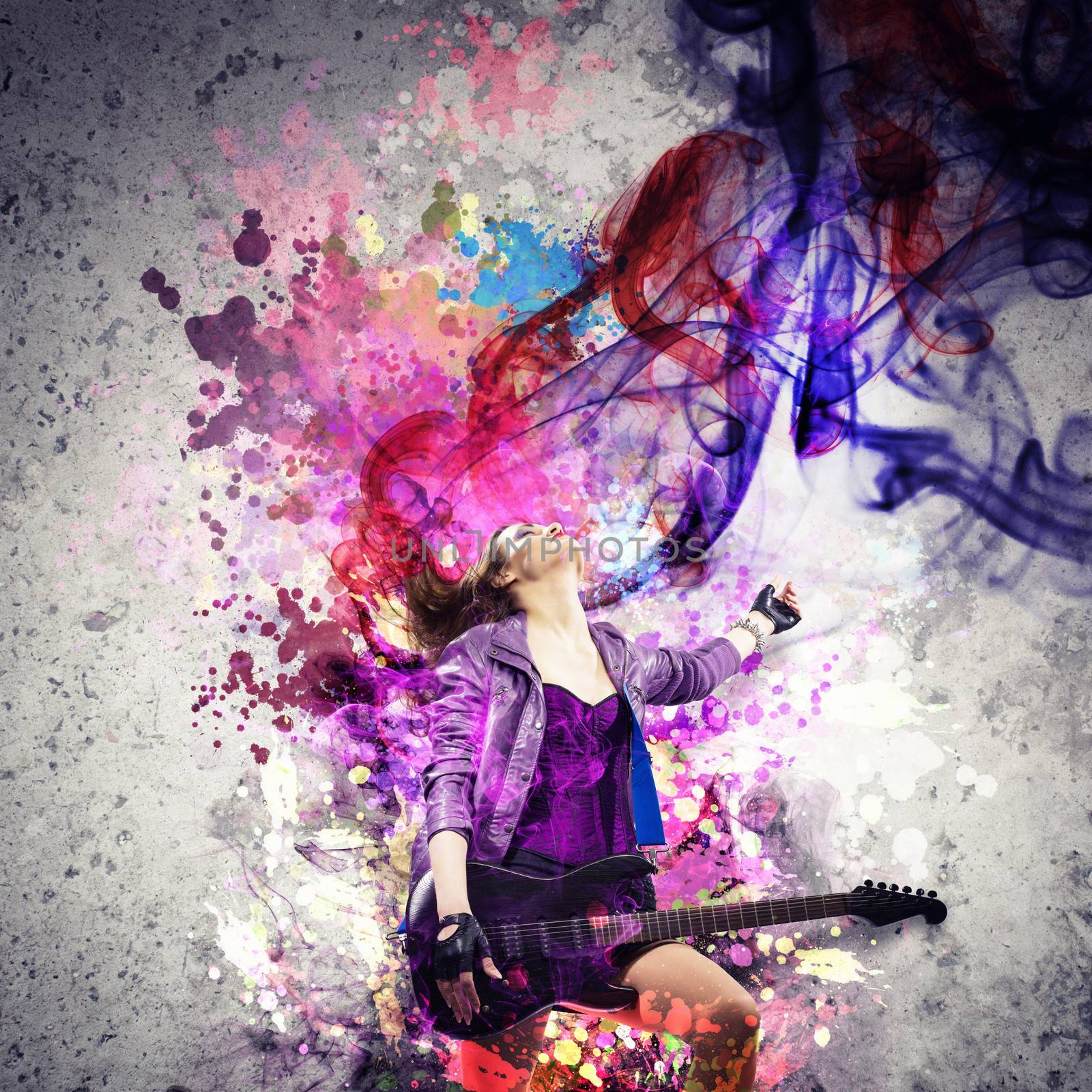 Young attractive rock girl playing the electric guitar