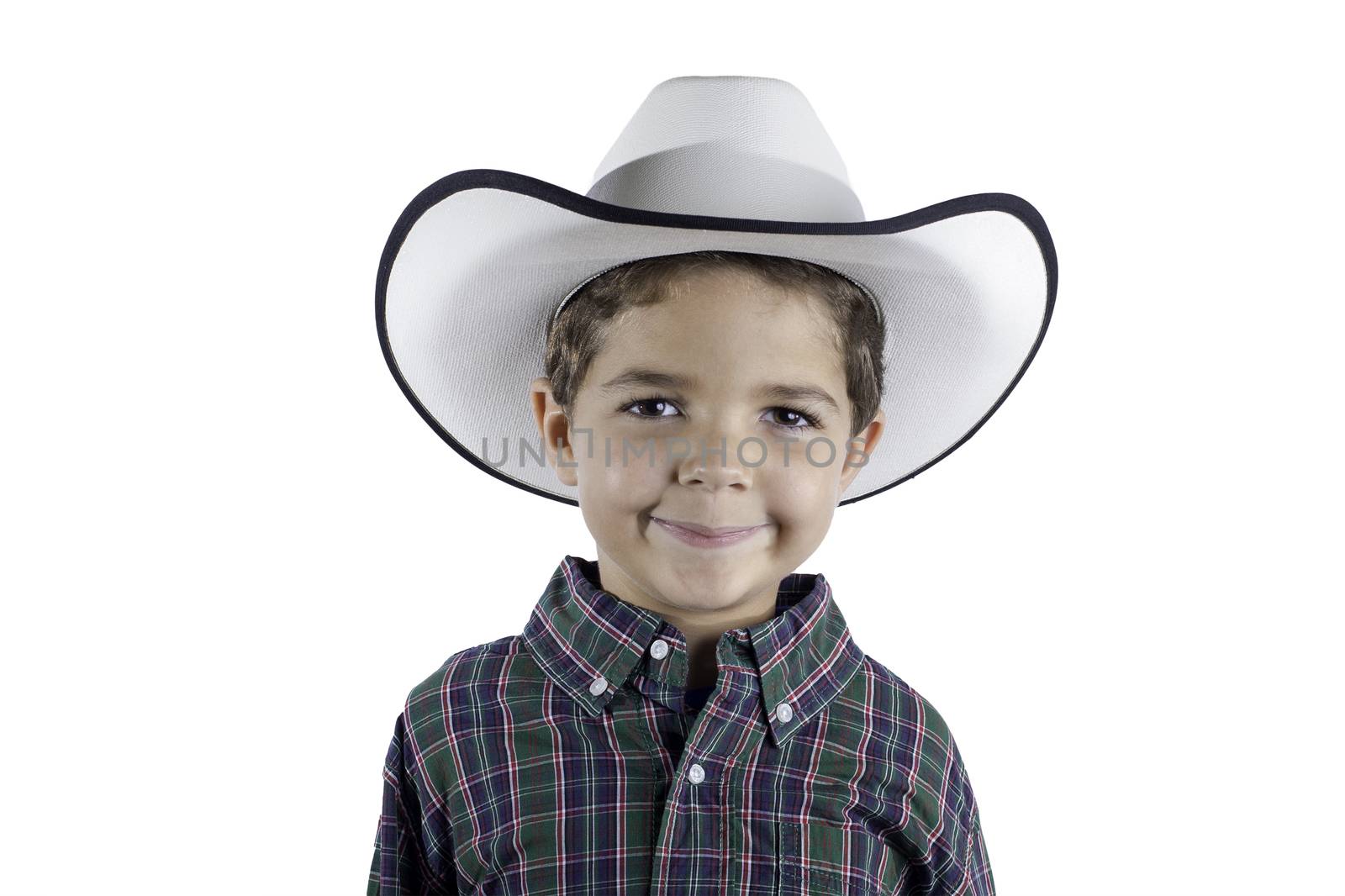 A young boy dressed in western attire isolated on a white background.