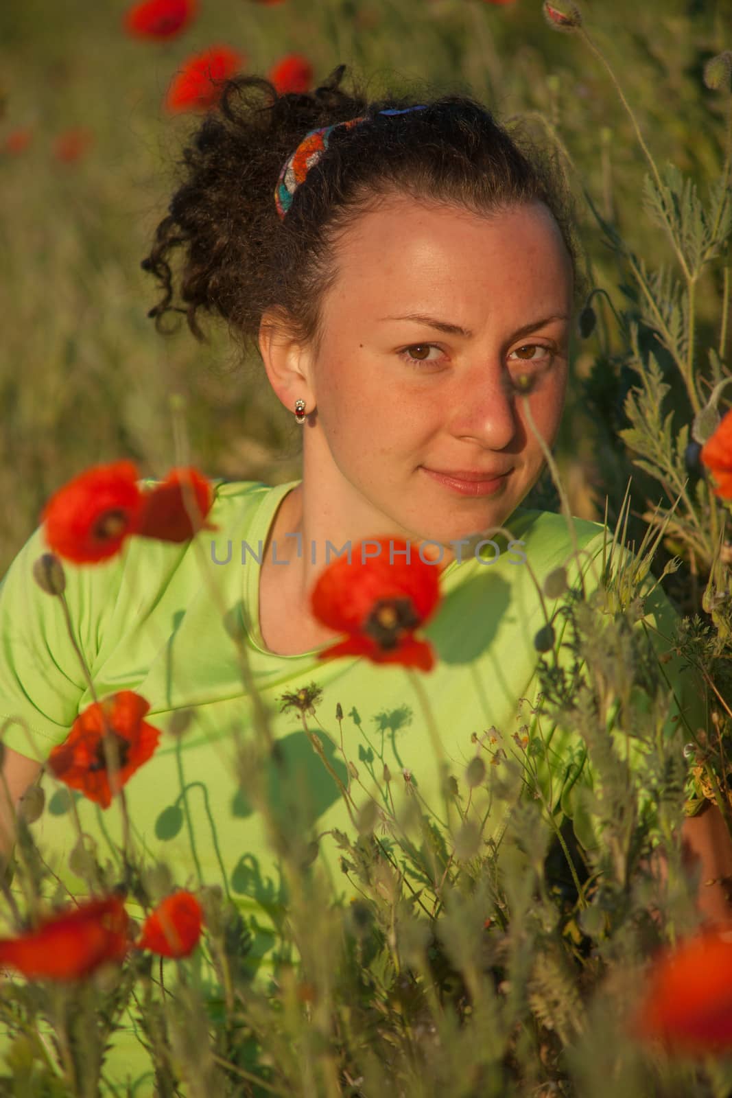 young beautiful woman on cereal field in summer.