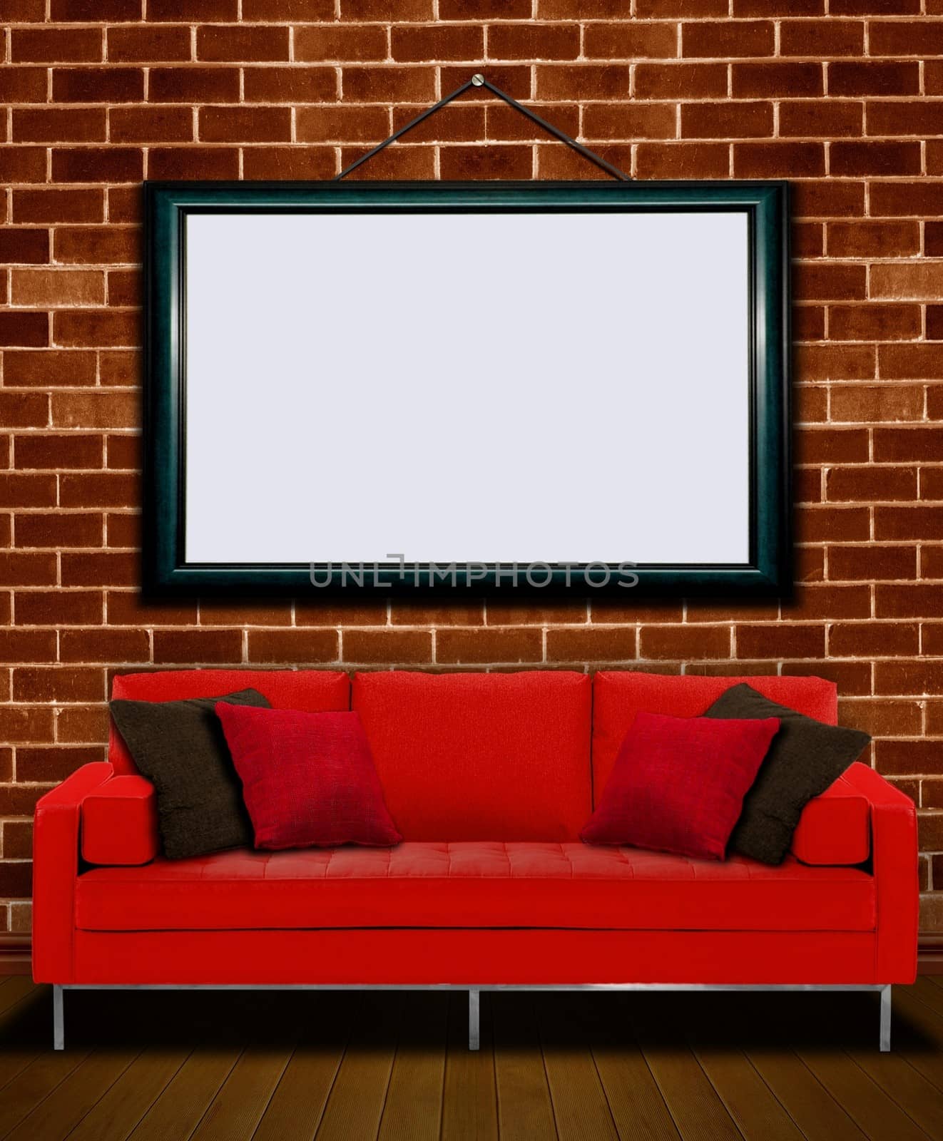 Red sofa with picture frame over brick wall