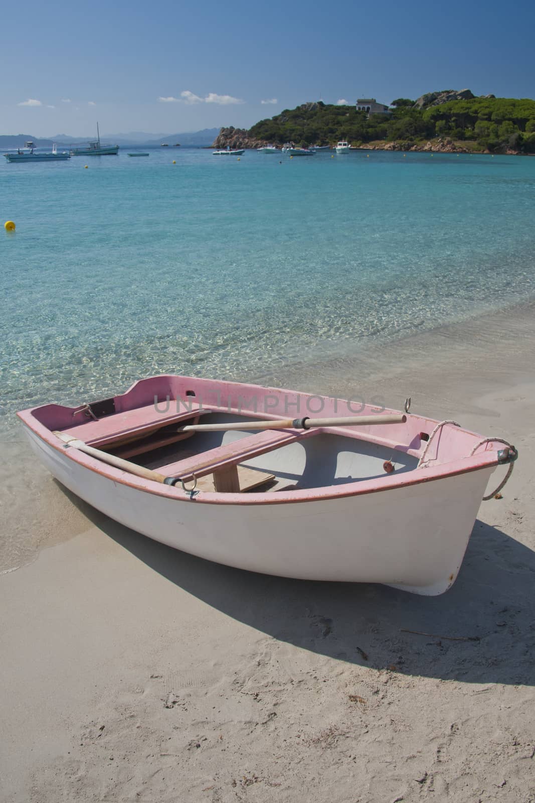 Boat on a  beach of Santa Maria, an island of the La Maddalena archipelago in Sardinia, Italy
