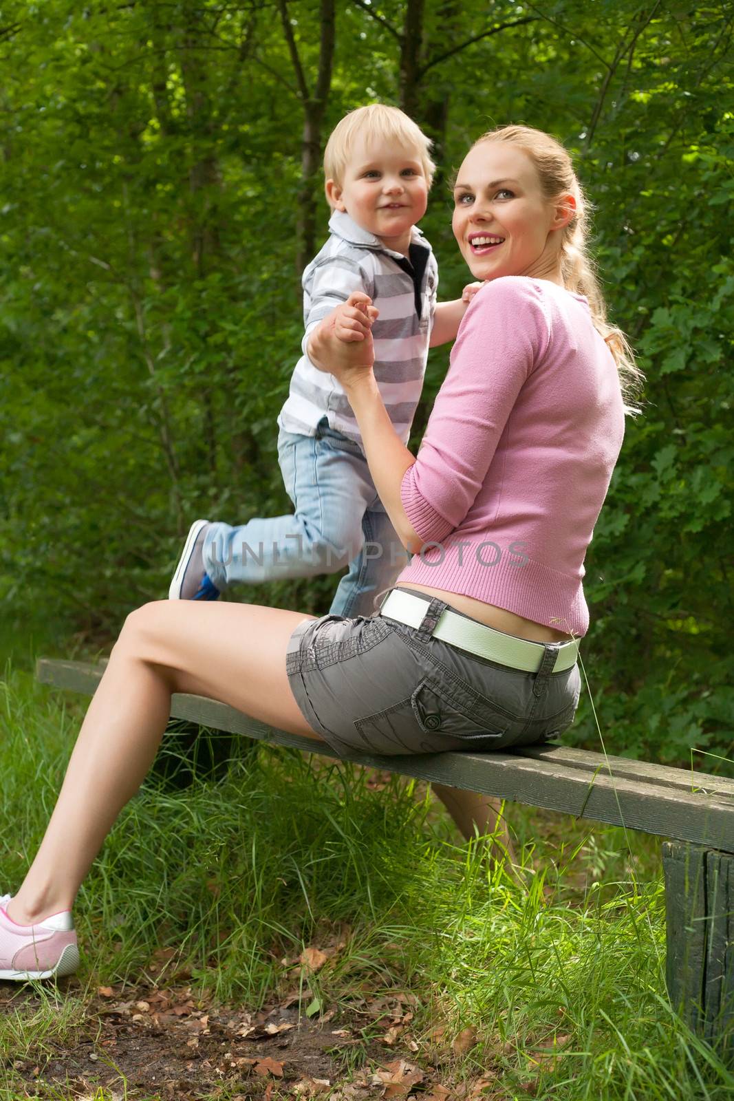 Happy mother and son having a nice day in the park