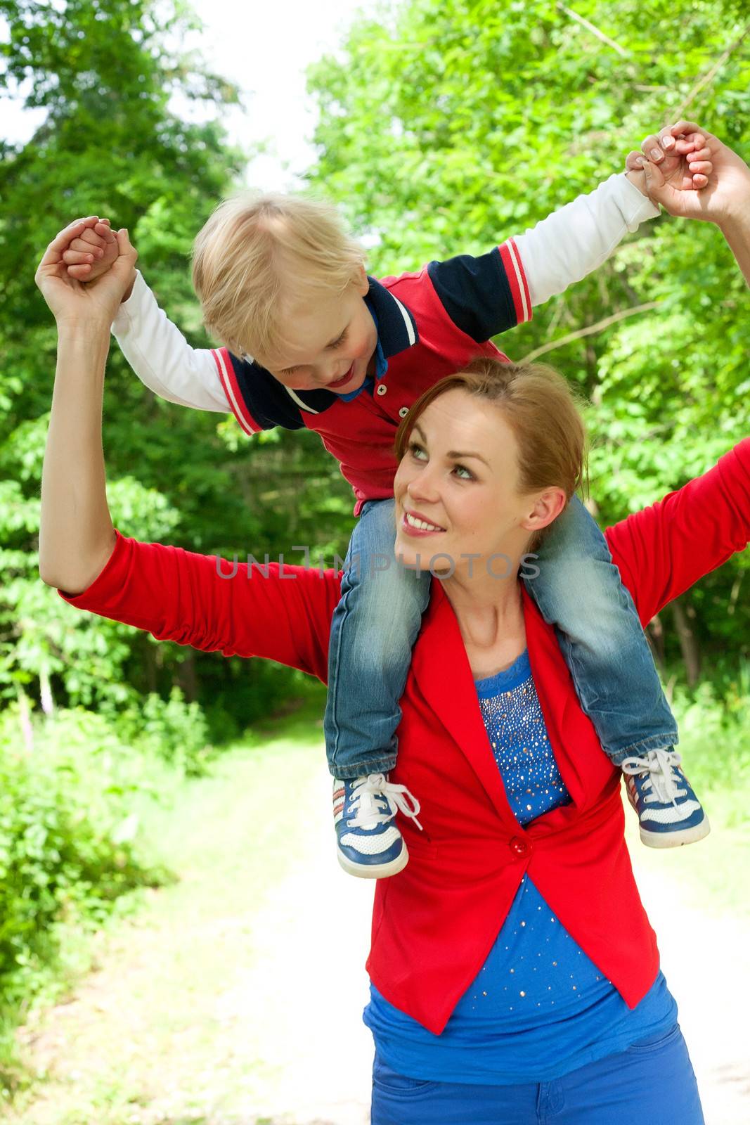 Happy mother and son having a nice day in the park