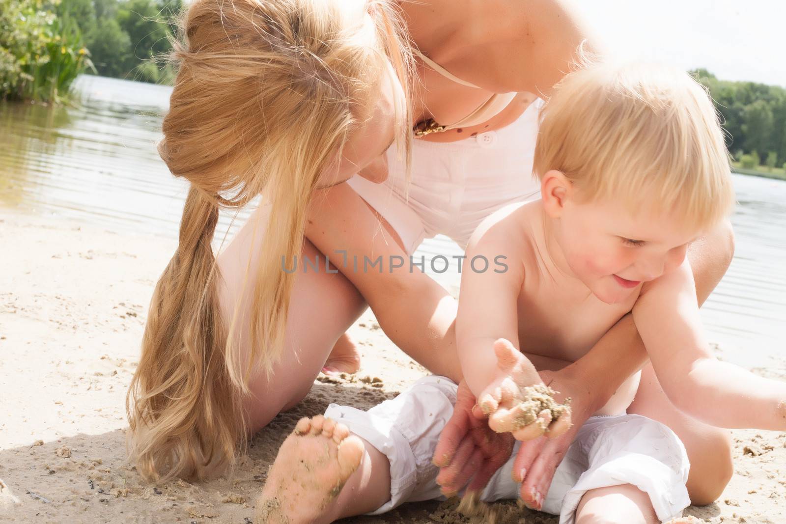 Happy mother and son having a nice day at the beach