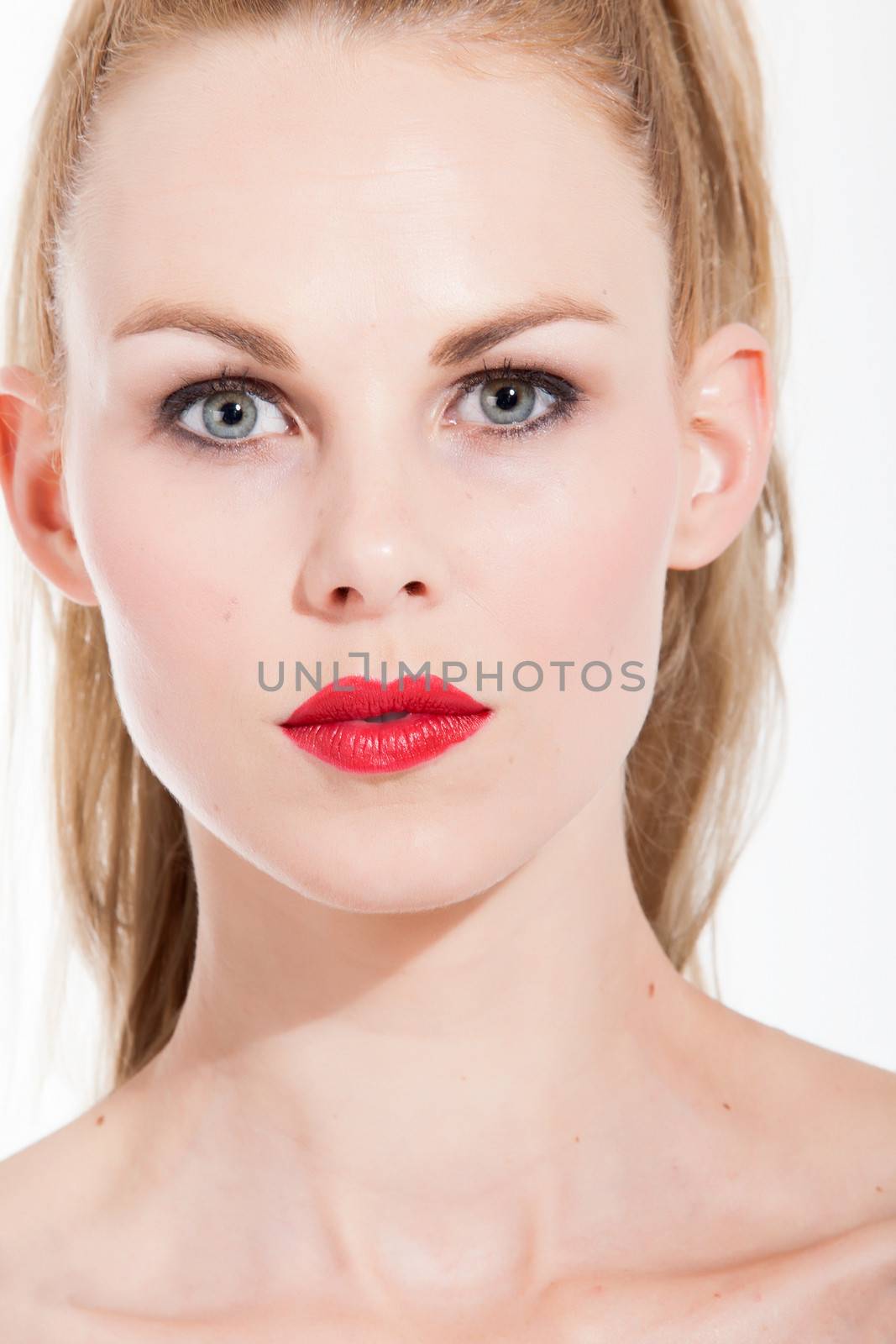 Beautifull young blond woman portrait in the studio