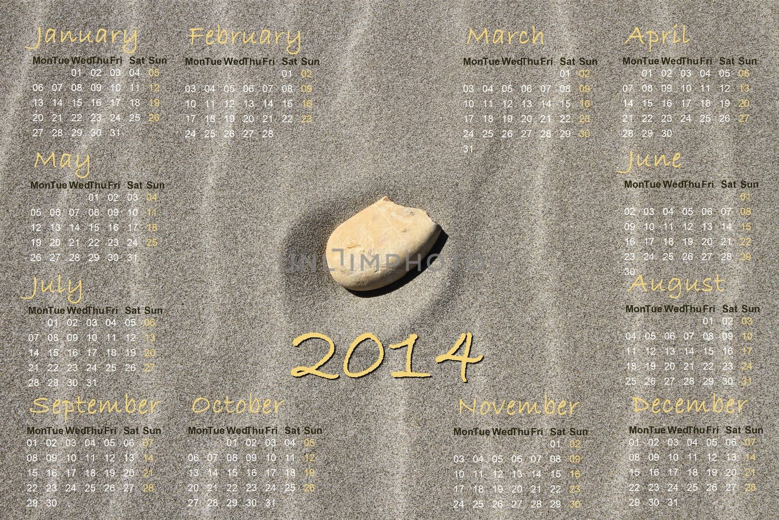 2014 english calendar with stone alone in the middle of beach sand waves