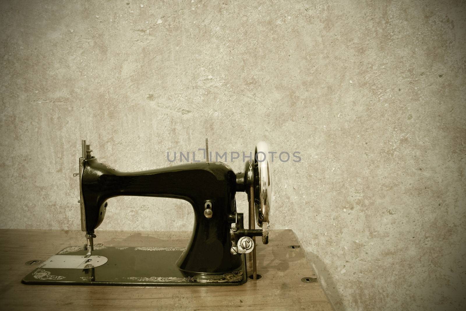 a very old sewing machine on a white background