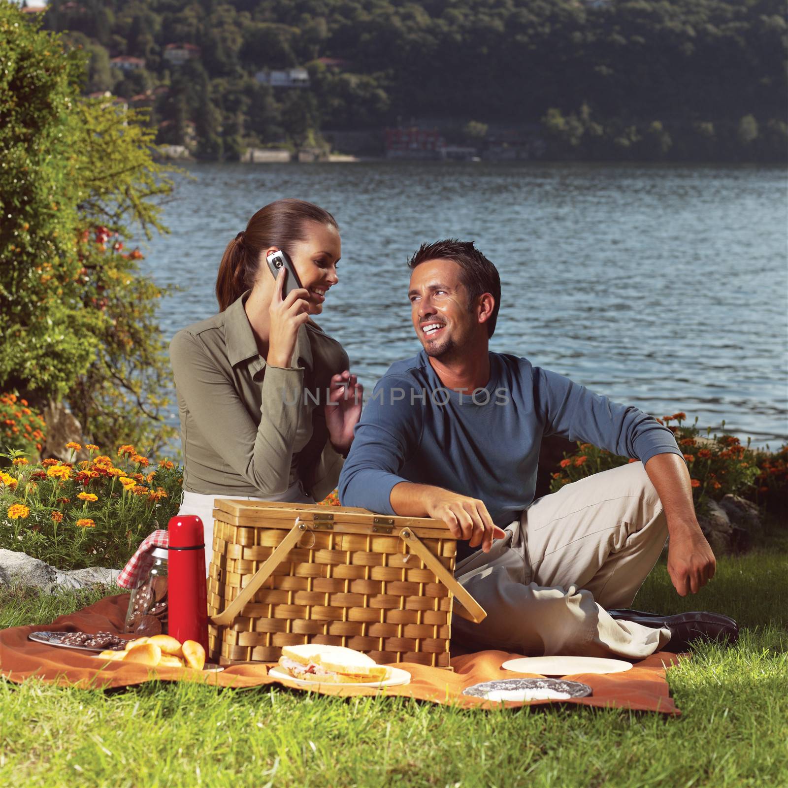 Happy family playing together in a picnic outdoors 