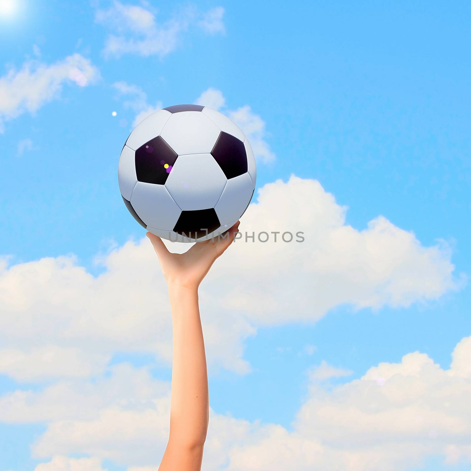 Close-up image of hand holding soccer ball