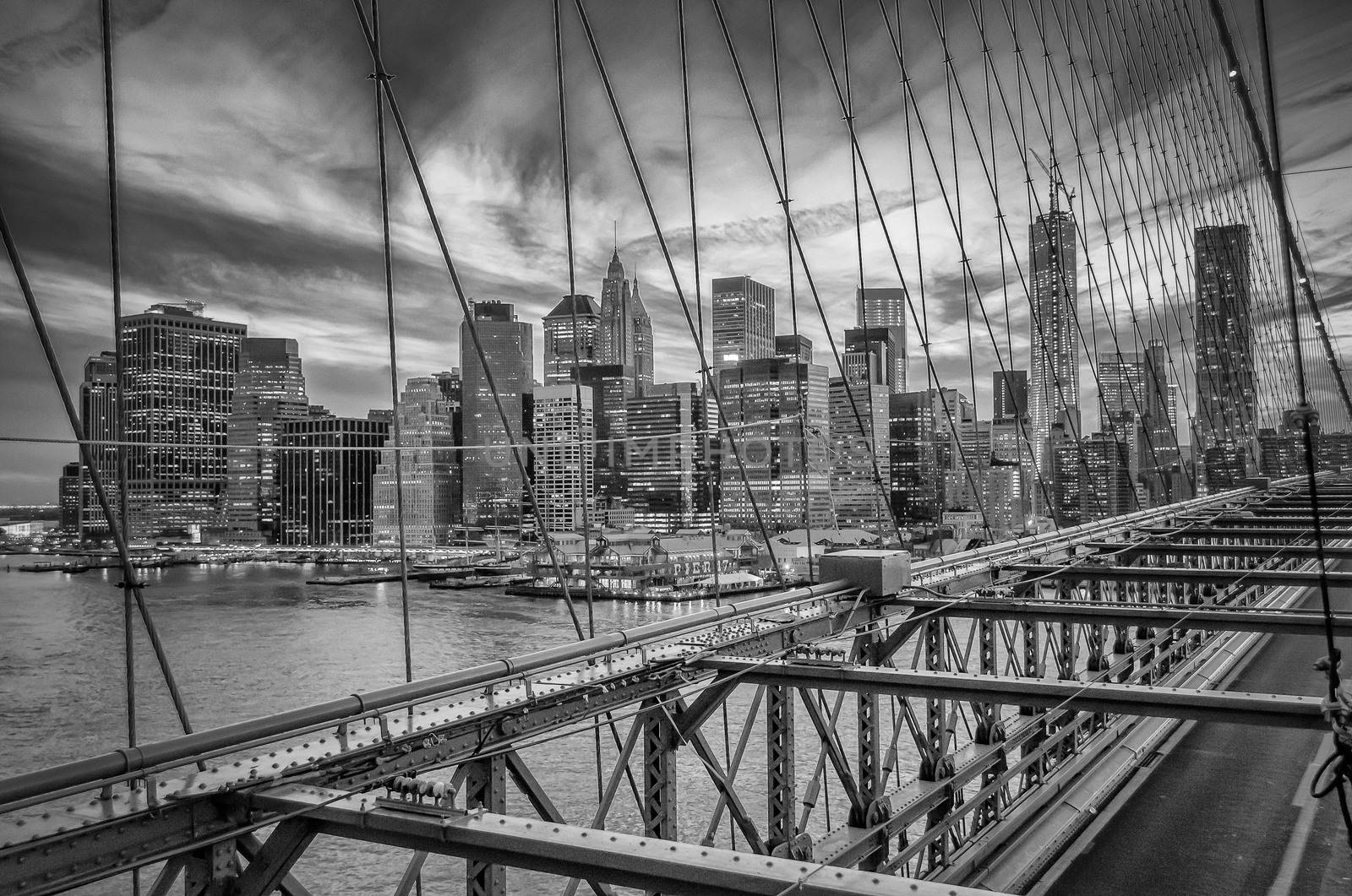 Manhattan View through the wires of Brooklyn Bridge