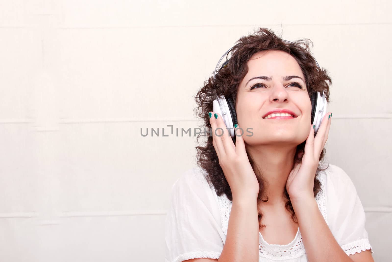 A young woman listening music with Headphones.