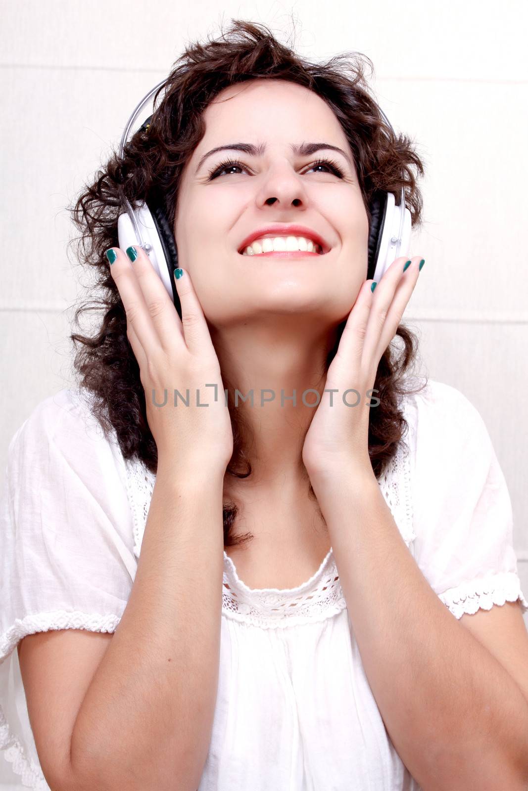 A young woman listening music with Headphones.