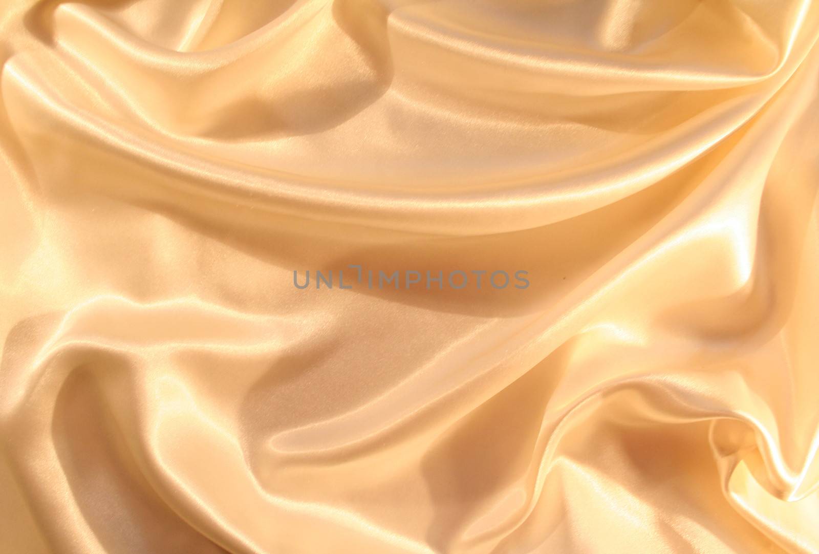 Smooth elegant golden silk as background by oxanatravel