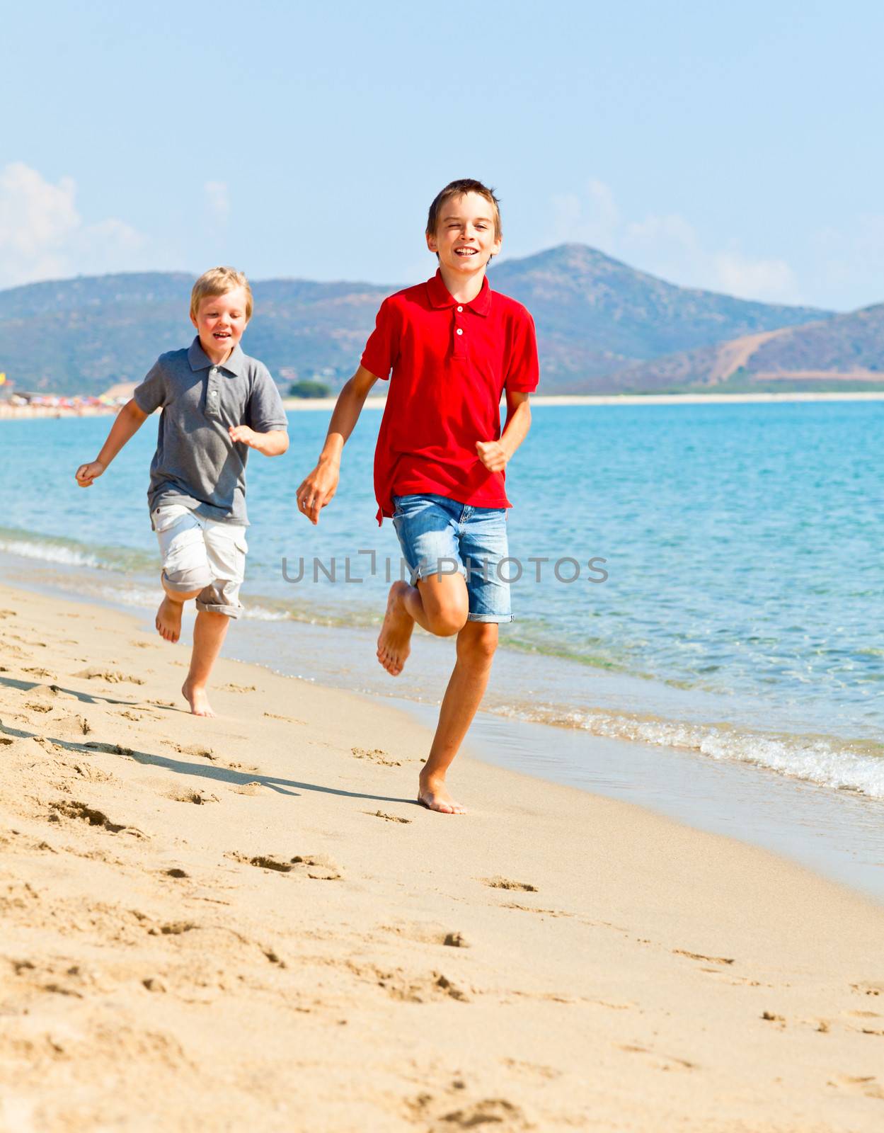 Boys on a beach by naumoid