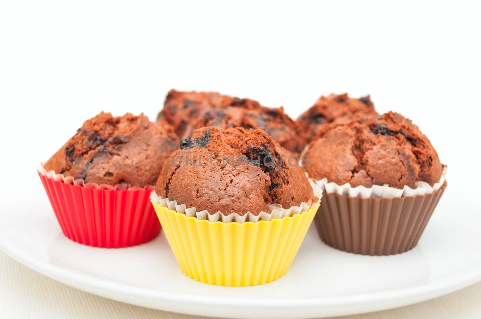 Chocolate Muffins With Blueberries On White Plate
